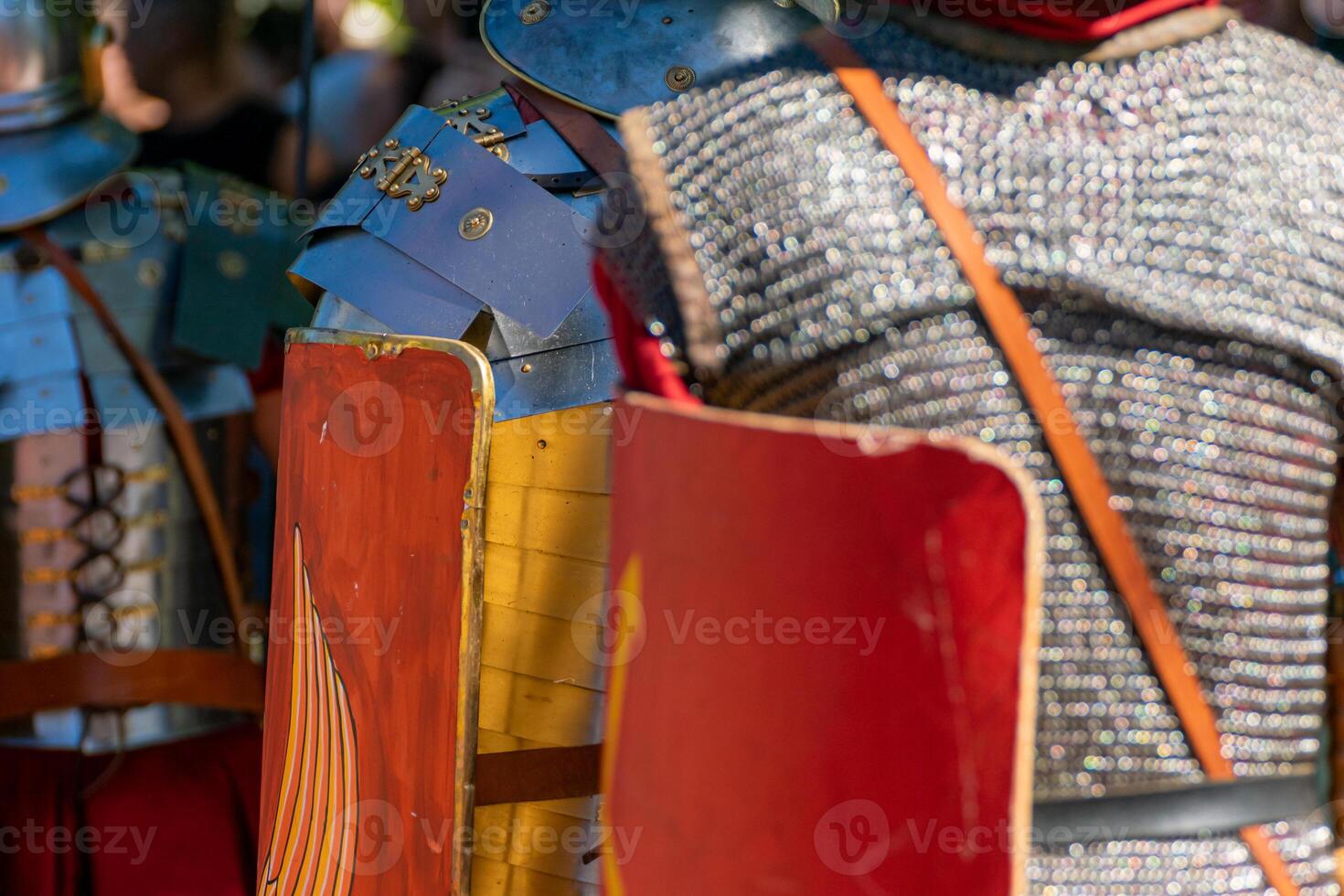 Roman legionaries in line seen from behind at a historical reenactment party about Ancient Rome. photo