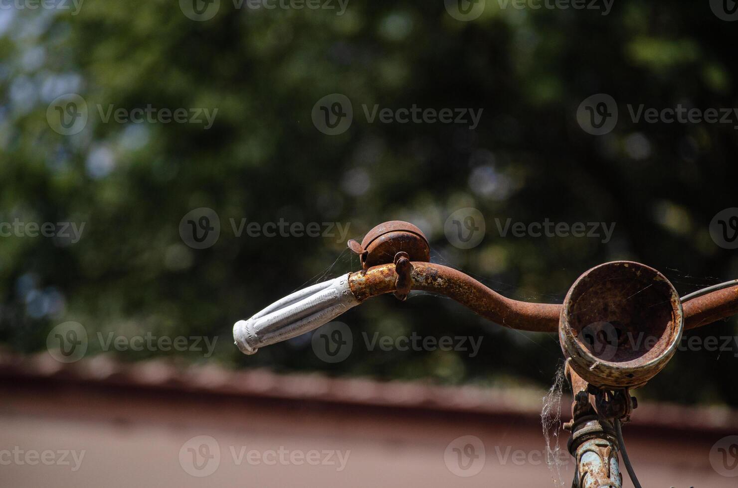 detail of the handlebars of a rusty old bicycle photo