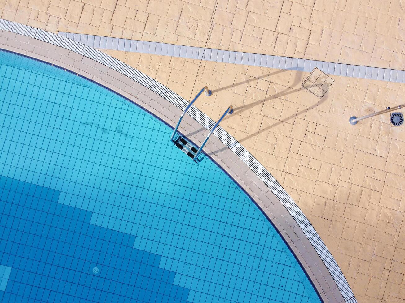 top view of a transparent water pool in summer time photo