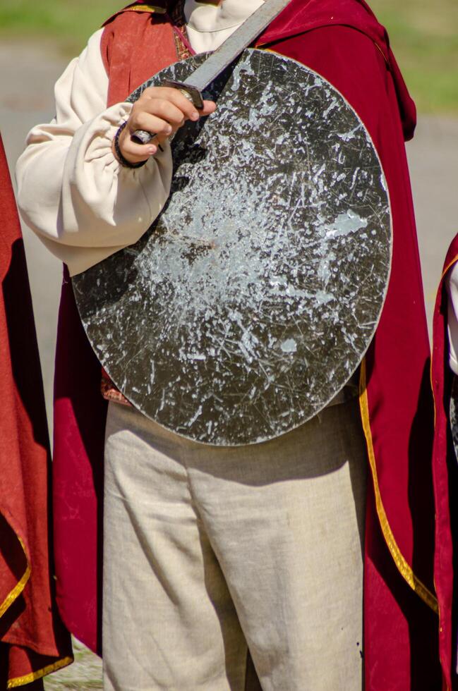 Unrecognizable person disguised in a medieval historical reenactment act. Historical event concept photo