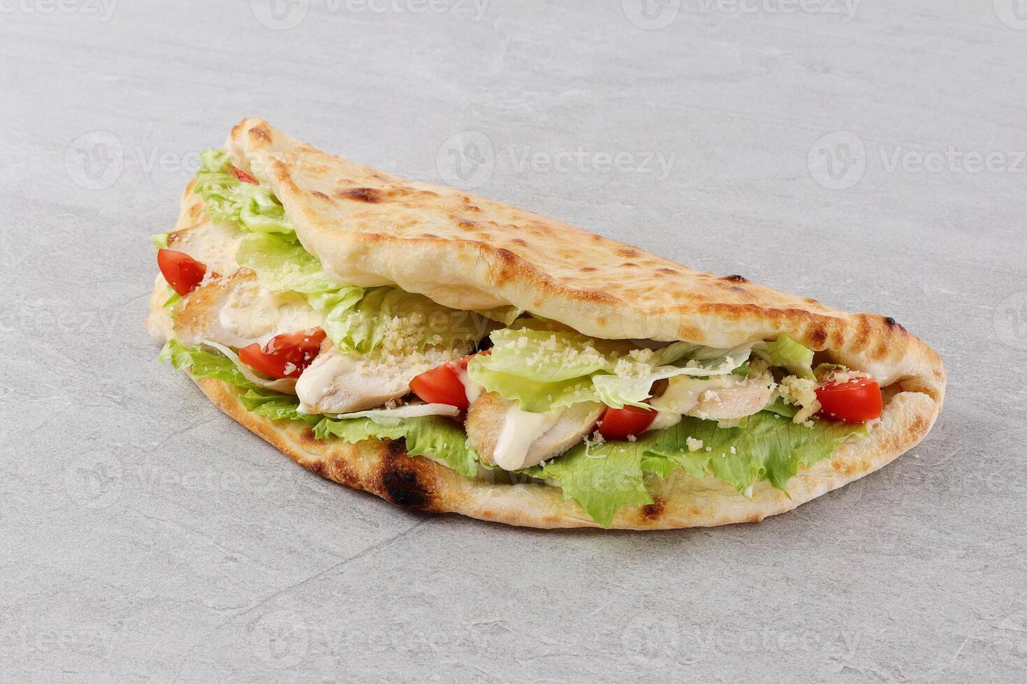 Opened open calzone italian pizza sandwich with cheese in plate homemade in Lithuania photo