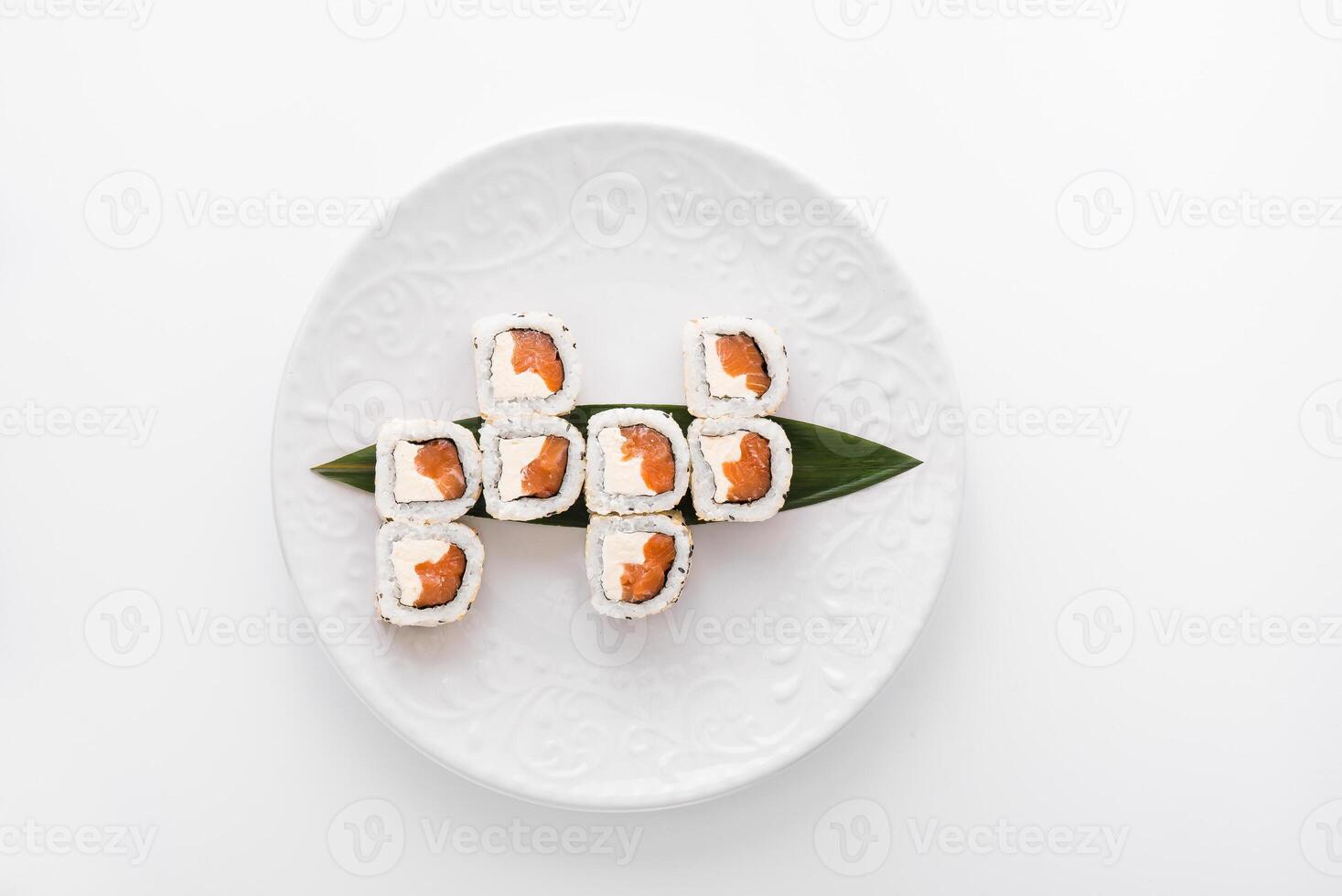 Close-up of sushi rolls made of sausage and covered with cabbage and ketchup. Homemade asian style. Sushi-food hybrids trend. Japanese food photo