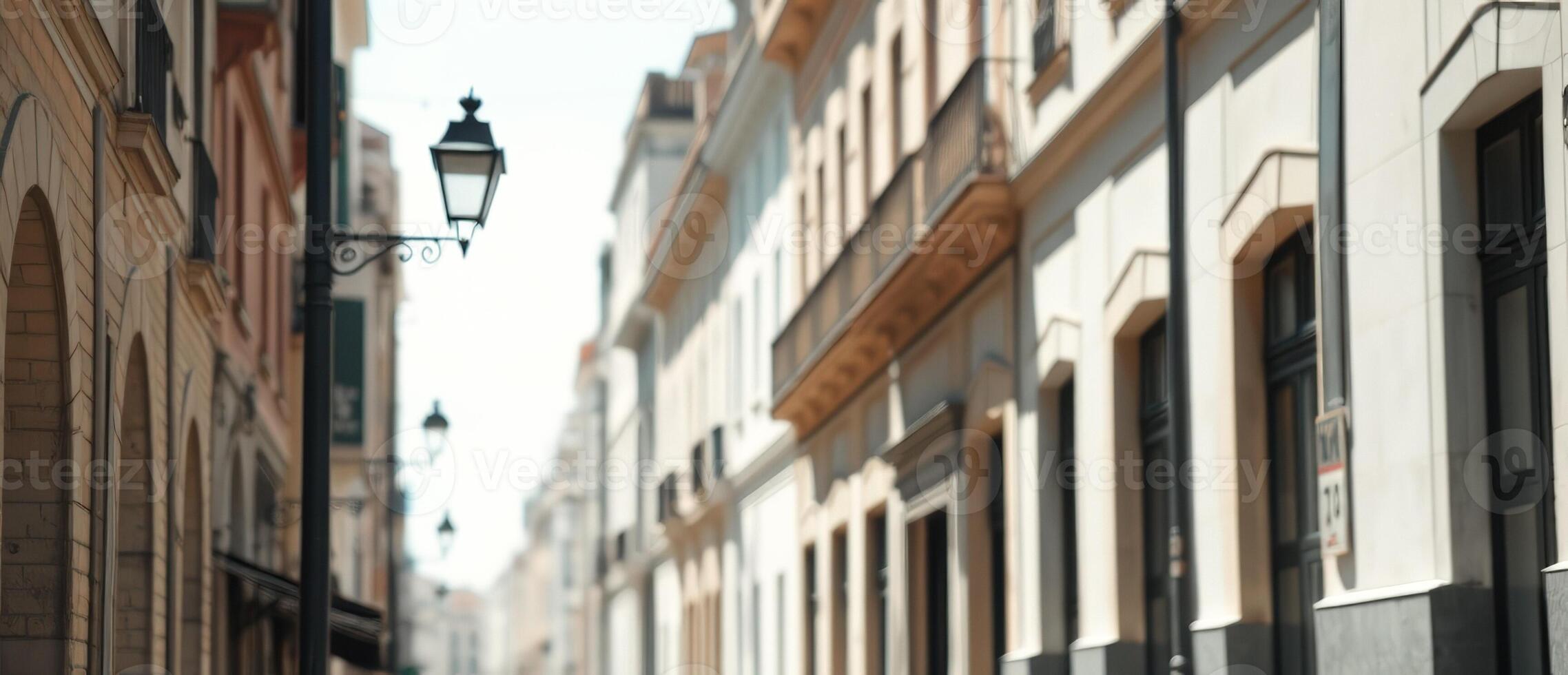 Old Street Lamp with Blurred Buildings in the Background photo