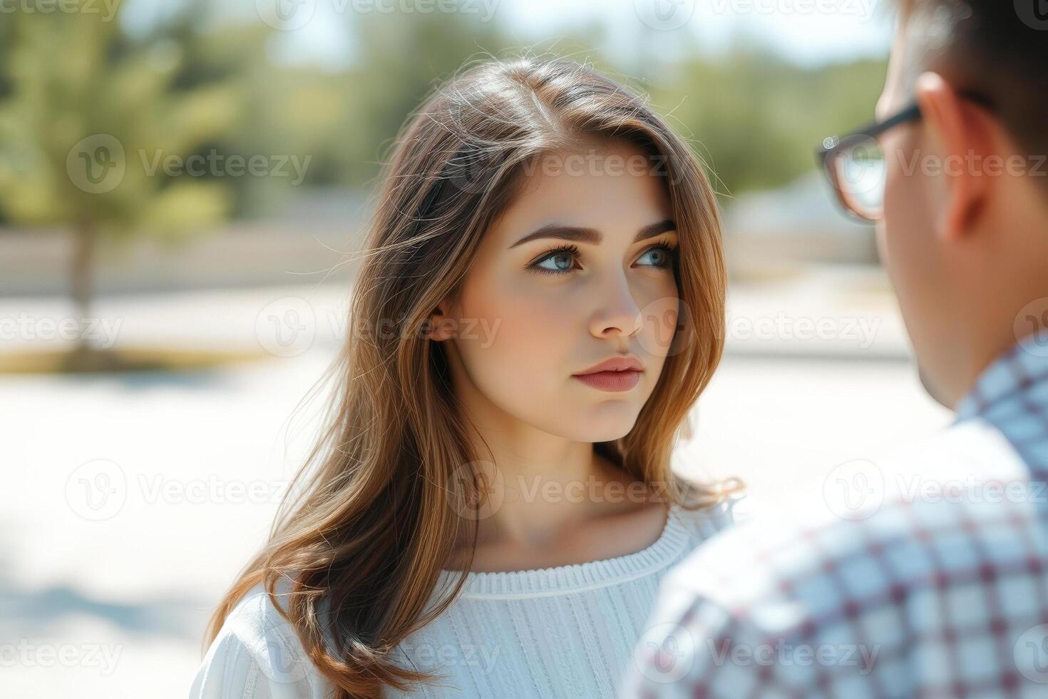 Woman looking at man in the park photo