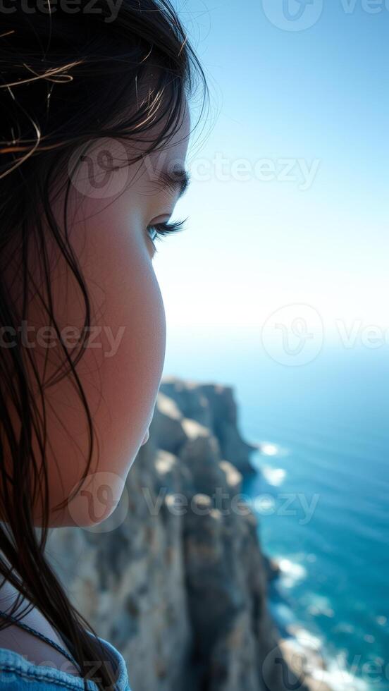 Woman looking out to the sea photo