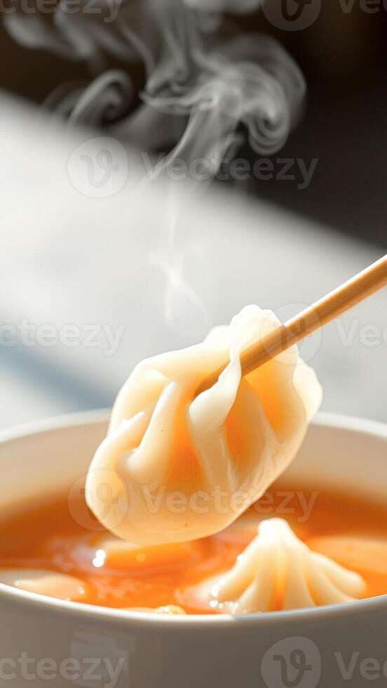 Steaming Dumpling in Bowl of Broth photo
