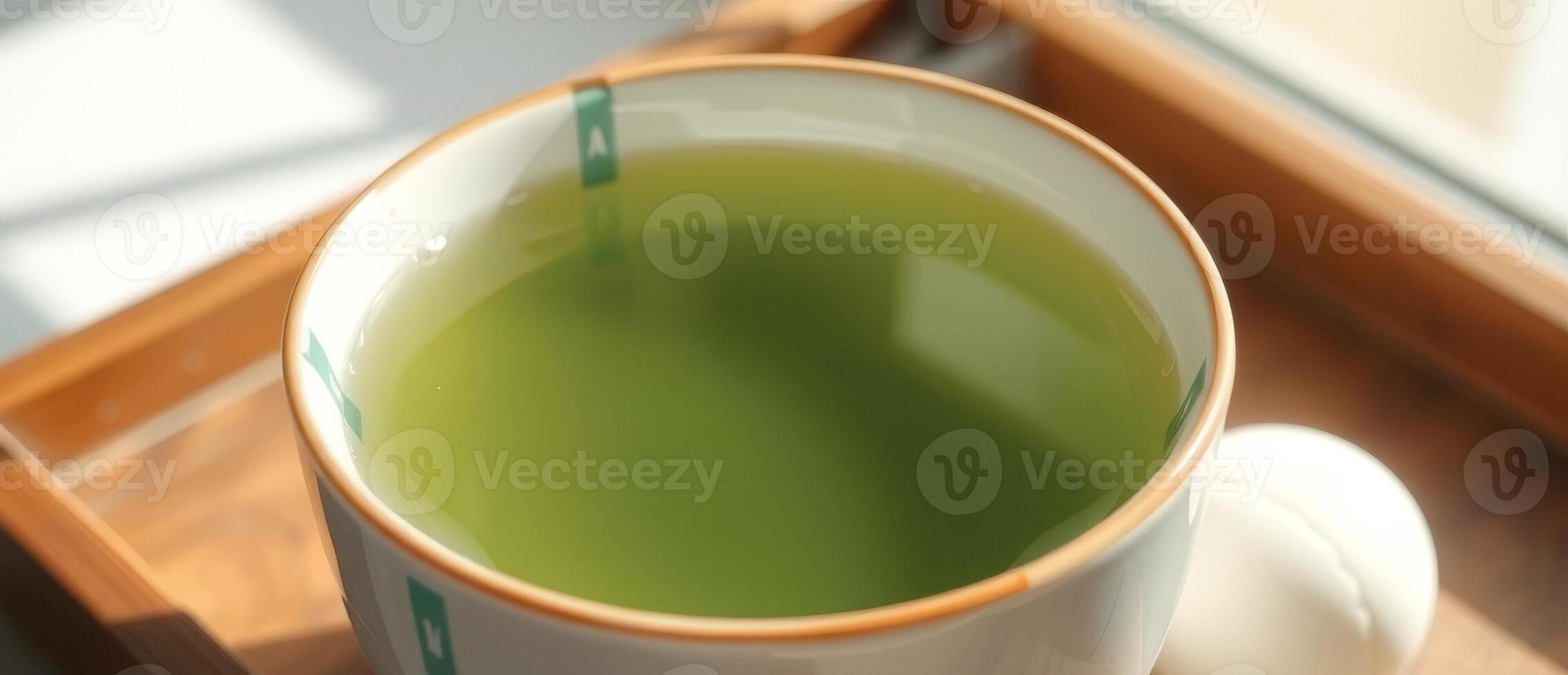 Cup of Green Tea on Wooden Tray photo