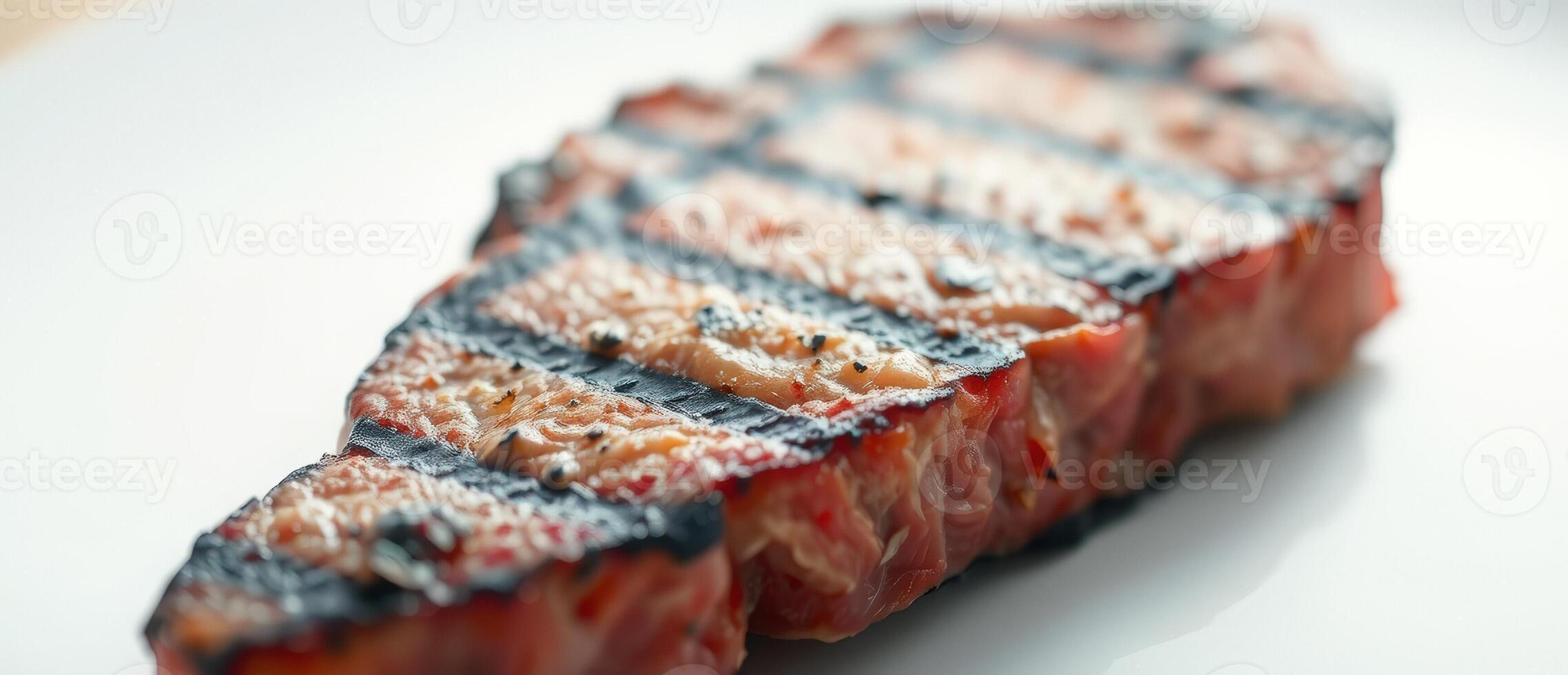 Close-up of a Grilled Steak on a White Plate photo