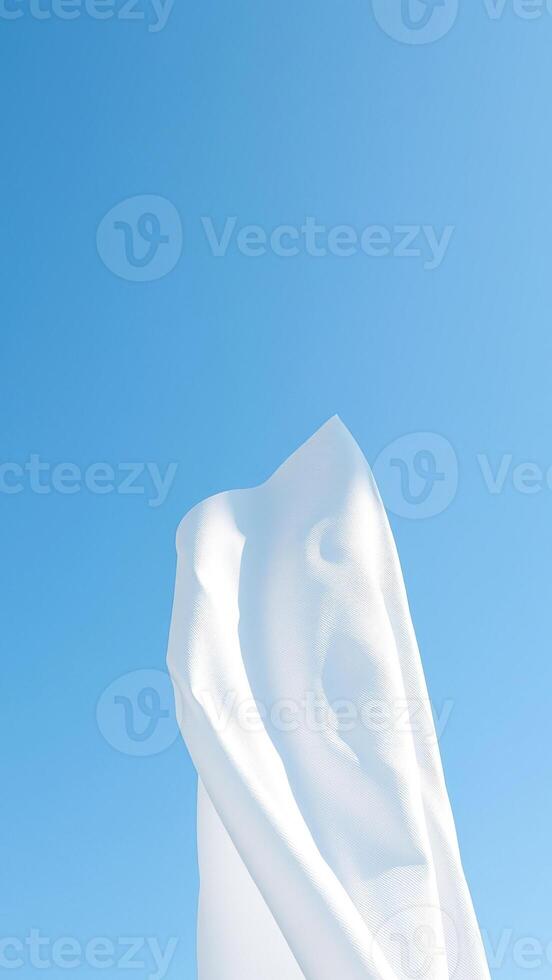White fabric against a blue sky photo