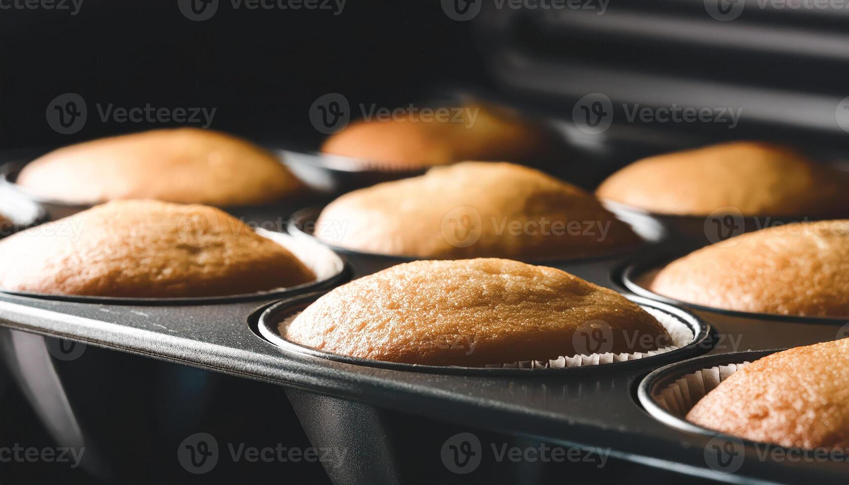 Close-up of freshly baked muffins in a baking pan photo