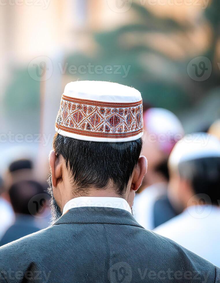 Close-up of a Muslim man wearing a traditional hat photo