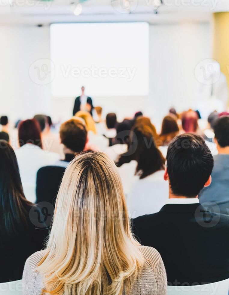 Audience Listening to a Speaker at a Conference photo