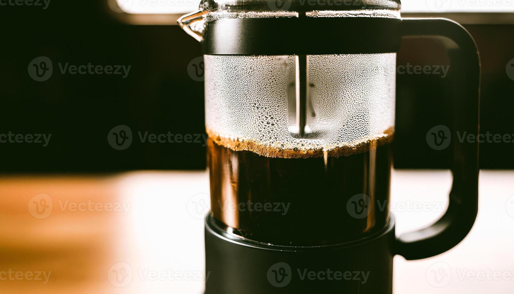 Closeup of a French Press with Freshly Brewed Coffee photo