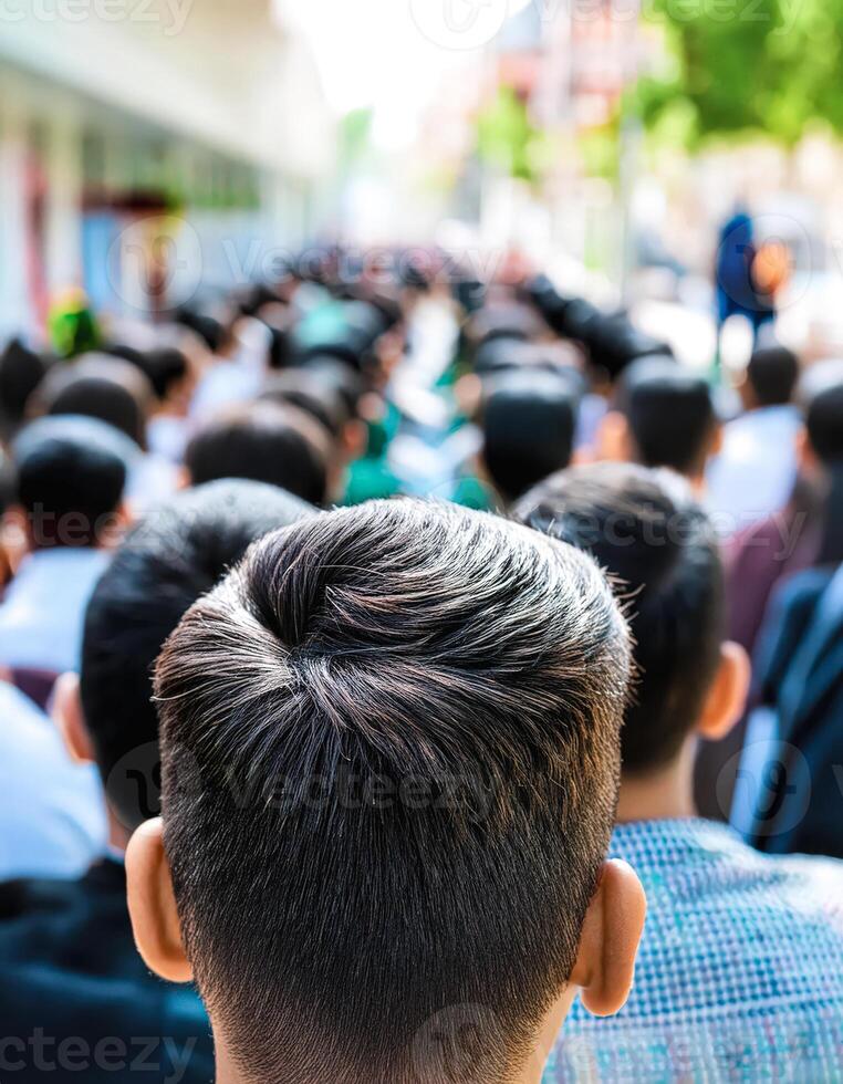 Close Up Of Back Of Man's Head In Crowd photo