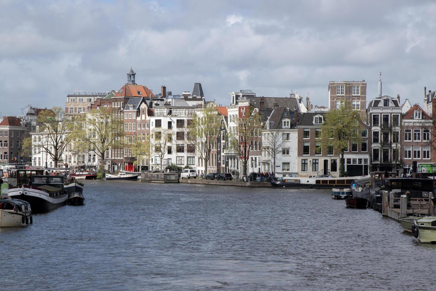 View From The Blauwbrug Bridge At Amsterdam The Netherlands 23-3-2024 photo