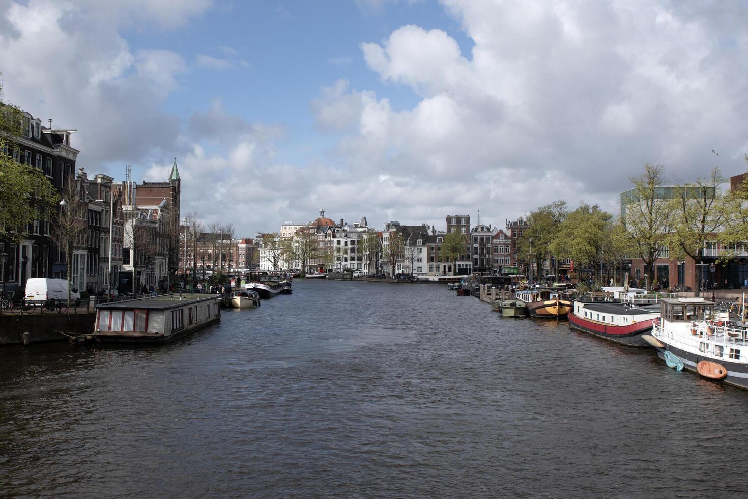 View From The Blauwbrug Bridge At Amsterdam The Netherlands 23-3-2024 photo