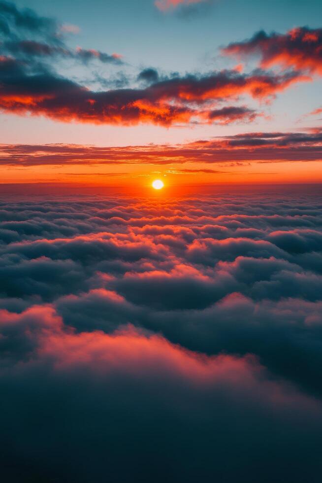 Sunset over fluffy clouds illuminating the sky in vibrant colors above the horizon photo