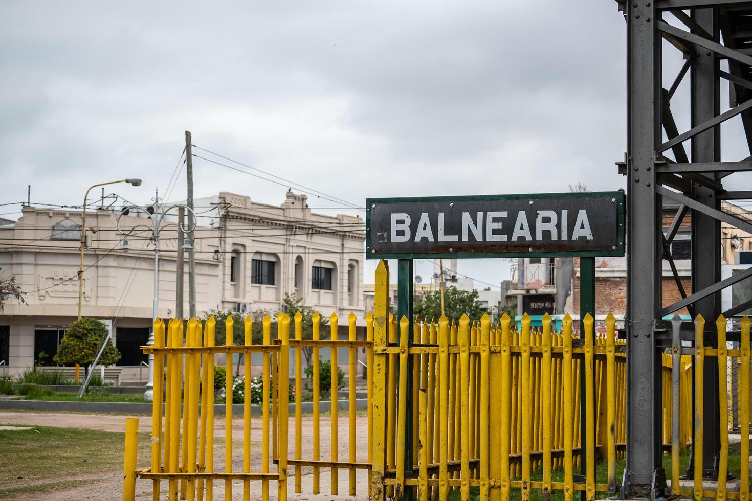 Balnearia, Cordoba, Argentina - June 21, 2024 - Old sign for the city of Balnearia, in the background you can see part of the city center. photo