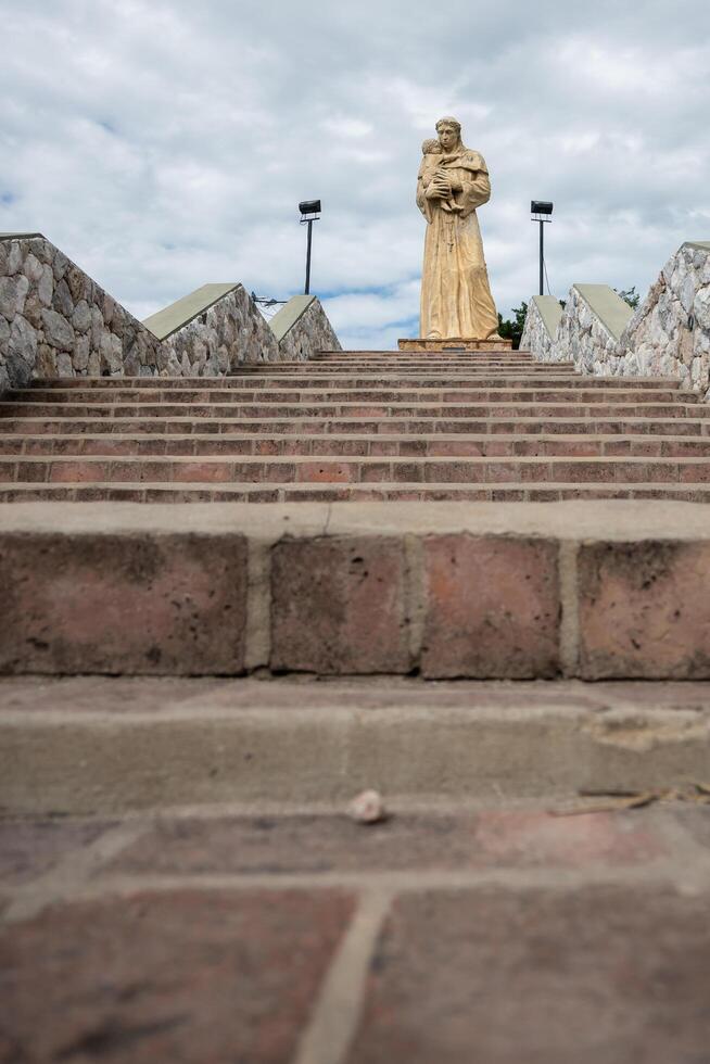 Valle Hermoso, Cordoba, Argentina - December 25, 2023 - Great statue of San Antonio de Padua, located in one of the entrances to the city of Valle Hermoso. photo