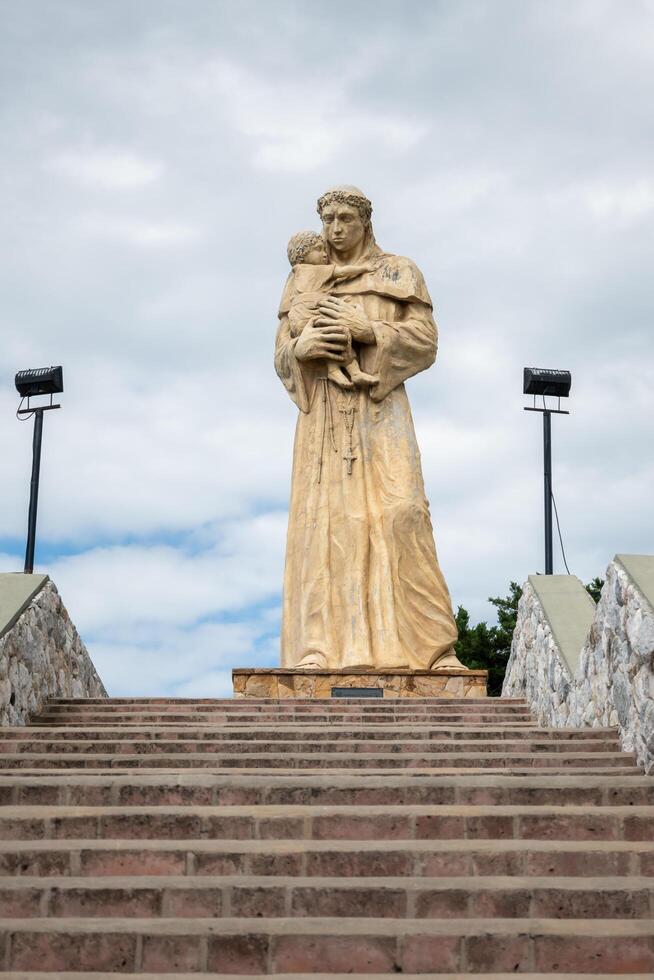 Valle Hermoso, Cordoba, Argentina - December 25, 2023 - Great statue of San Antonio de Padua, located in one of the entrances to the city of Valle Hermoso. photo