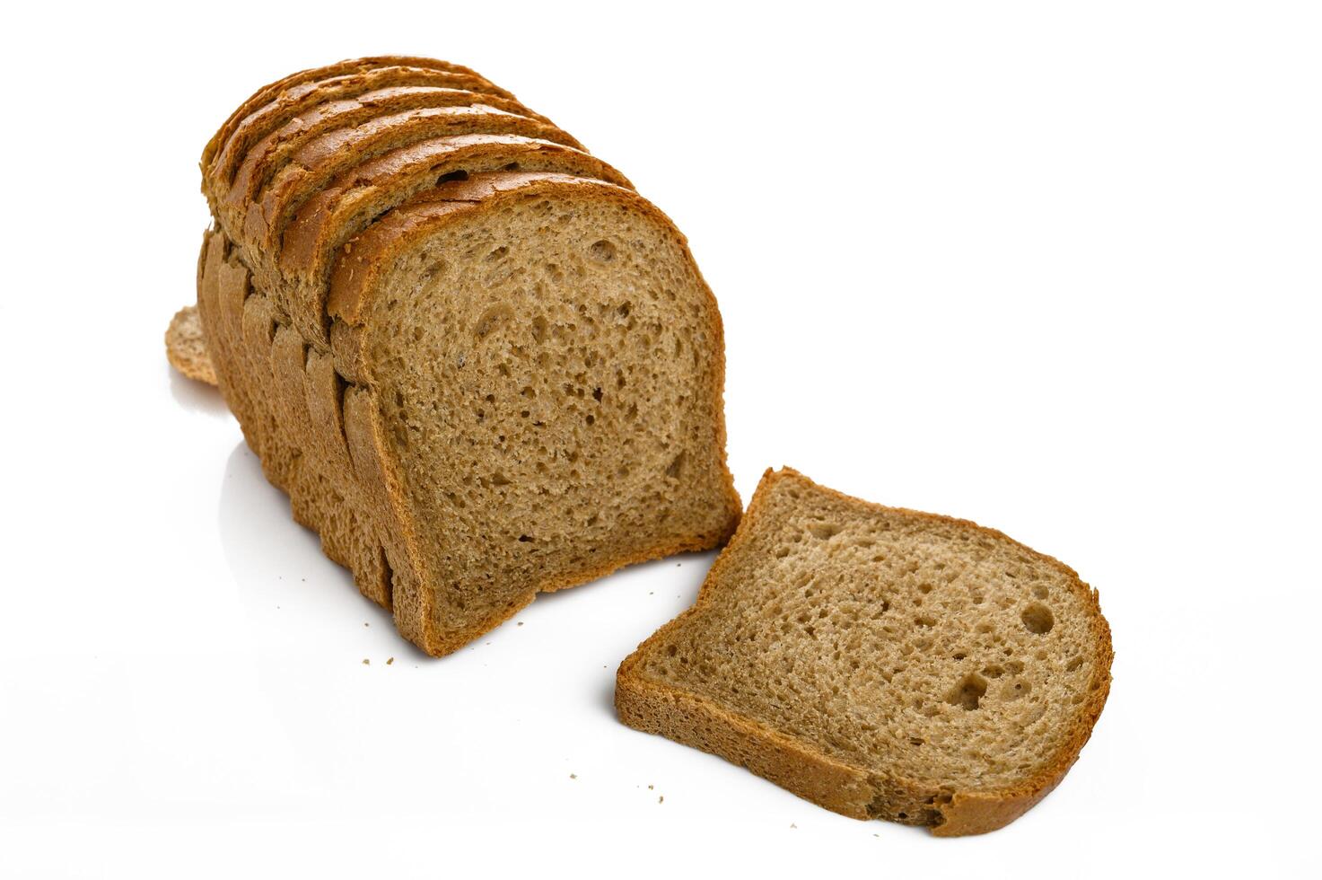 Sliced crusty whole grain bread isolated on white photo