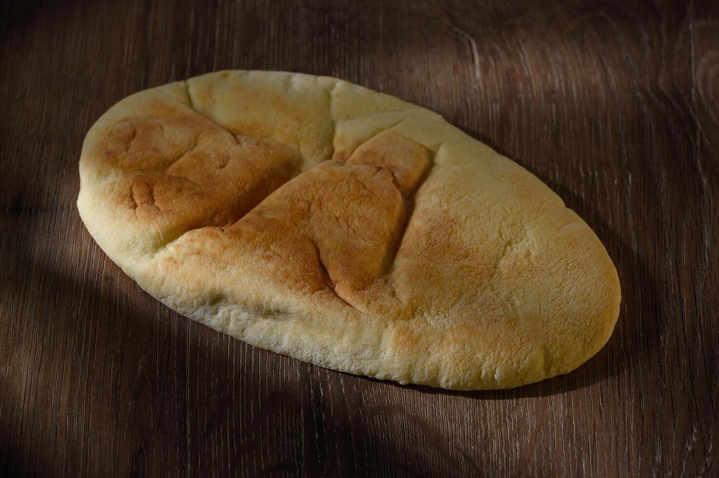 Close-up of bread on cutting board photo