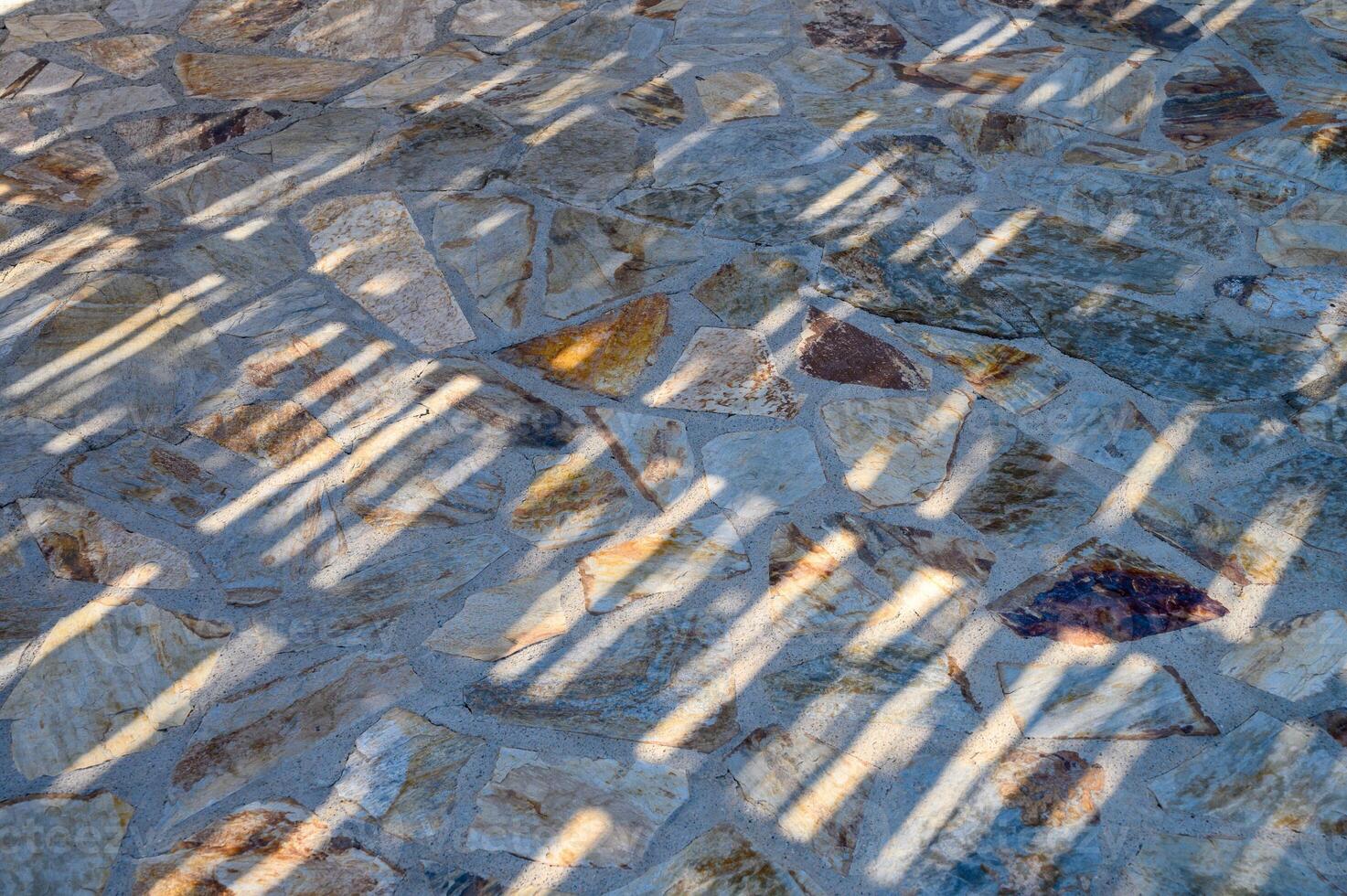 A cobblestone walkway glistens under the suns rays photo