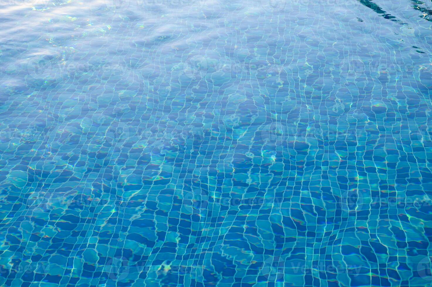 Swimming Pool Surface With Light Reflection and Water Ripple Patterns photo