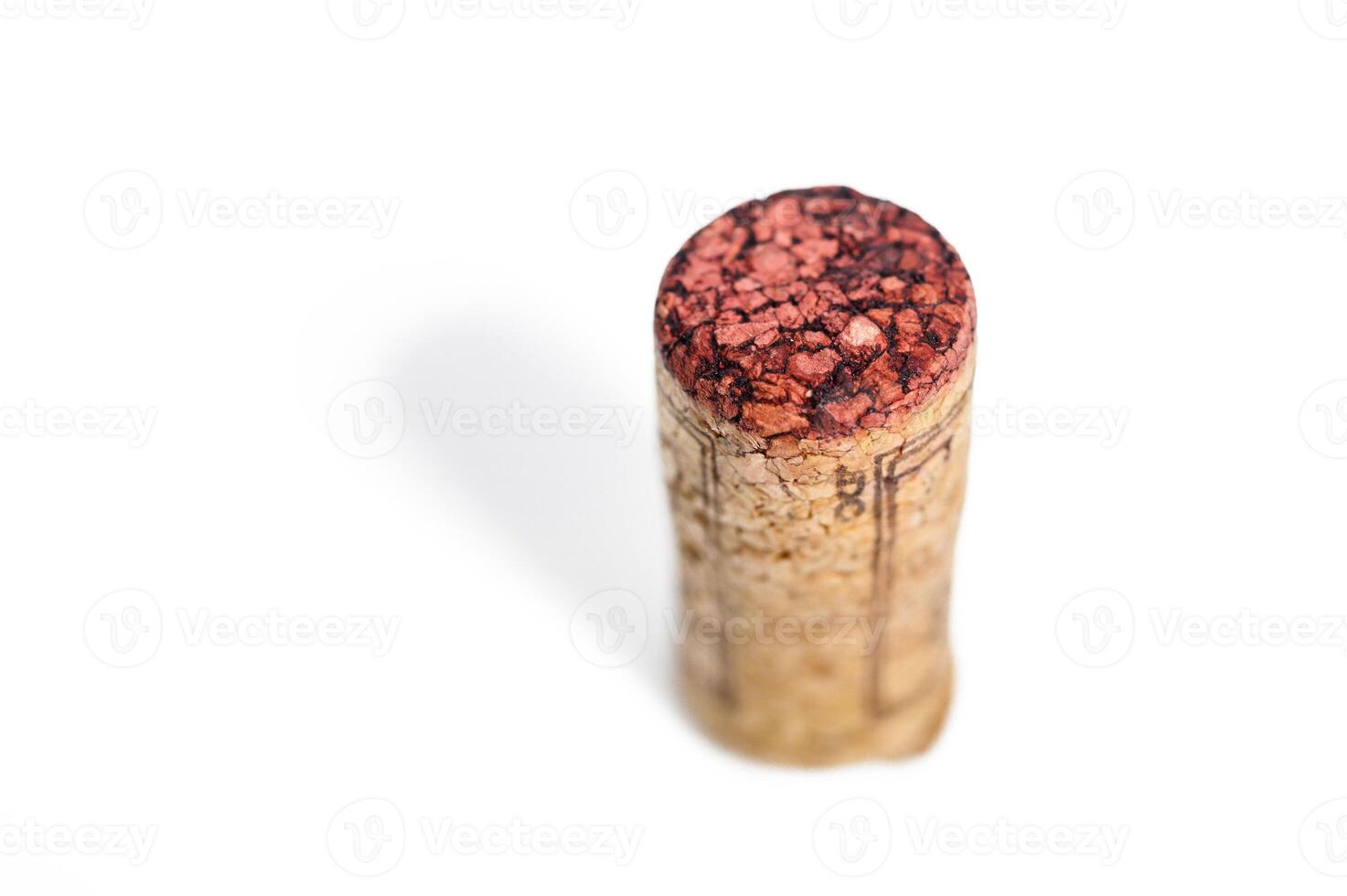 Blank wine cork isolated on white background close up photo