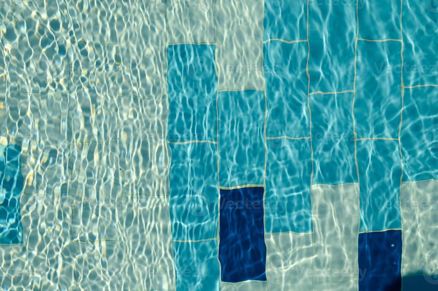 Beautiful sun reflections of water in the pool. Summer. Flight holidays. Blue water. photo