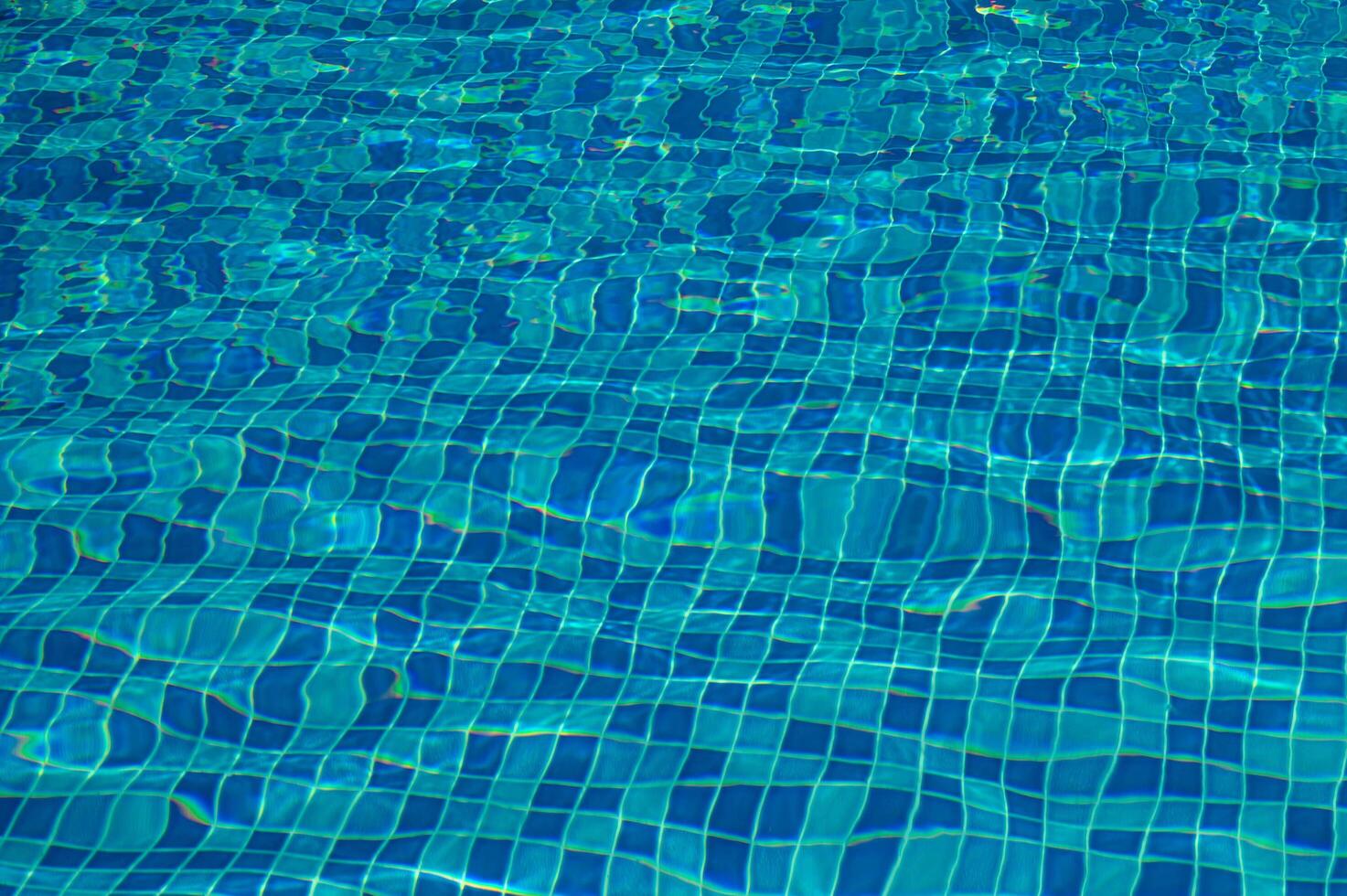 Shining blue water ripple background photo