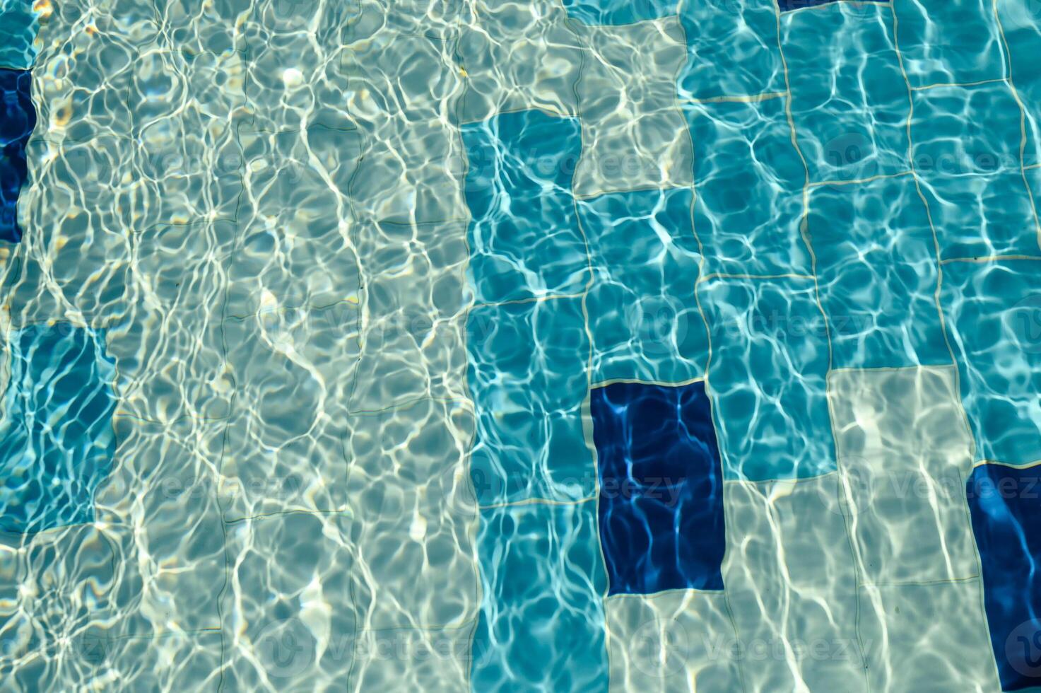 Swimming Pool Surface With Light Reflection and Water Ripple Patterns photo