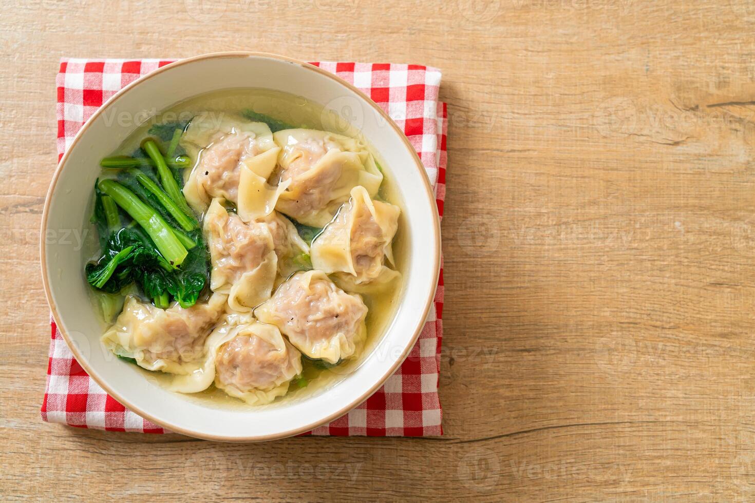 pork wonton soup or pork dumplings soup with vegetable photo