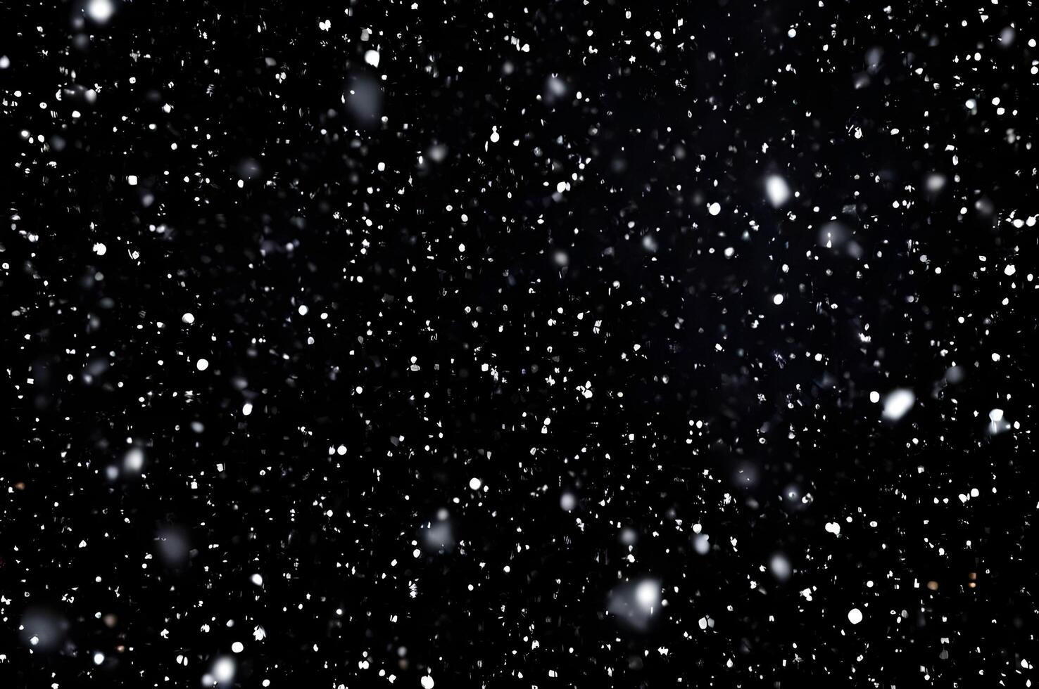 Detailed Snowfall Overlay Image Isolated on Black Background Perfect for Dynamic Visual Effects photo