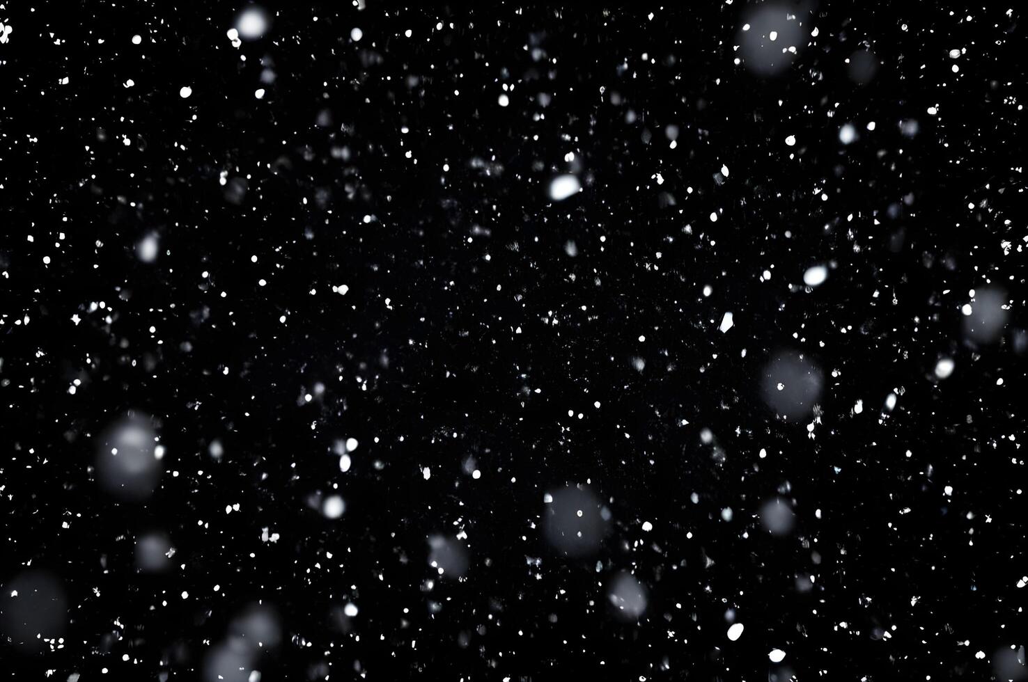 Detailed Snowfall Overlay Image Isolated on Black Background Perfect for Dynamic Visual Effects photo