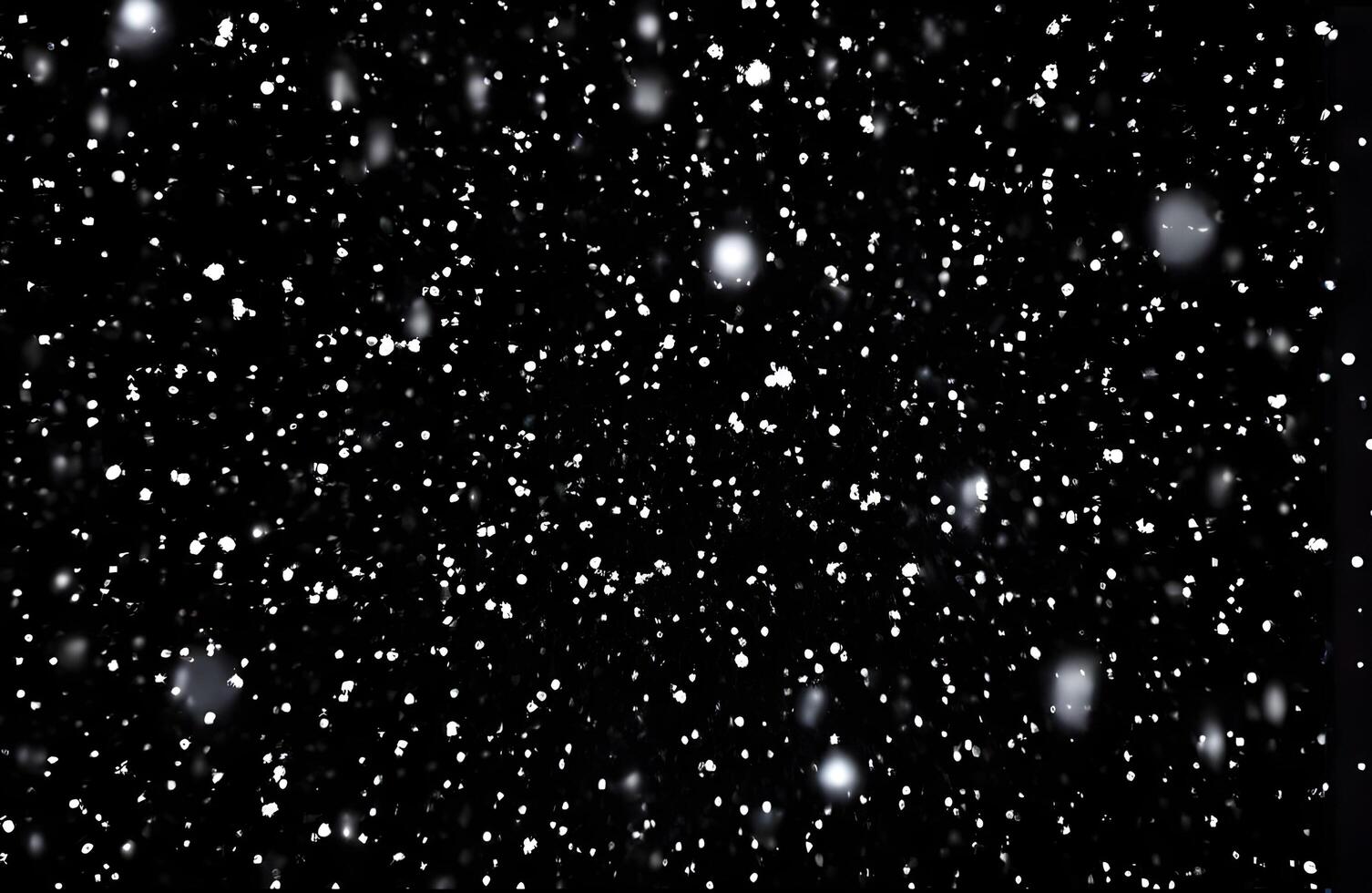 Detailed Snowfall Overlay Image Isolated on Black Background Perfect for Dynamic Visual Effects photo