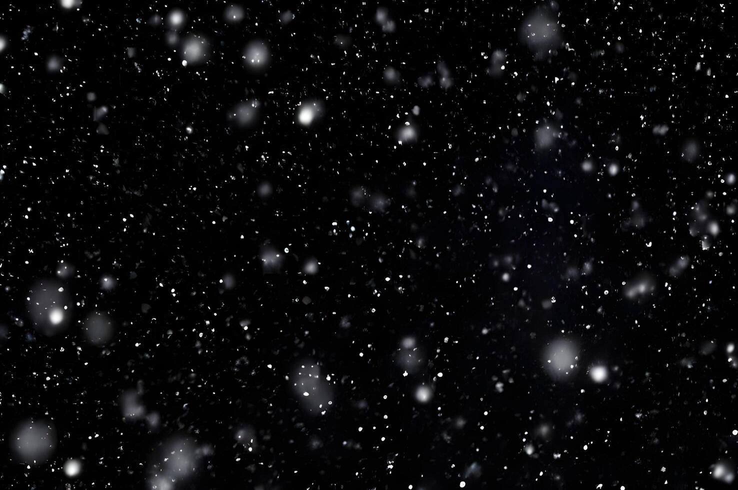 Detailed Snowfall Overlay Image Isolated on Black Background Perfect for Dynamic Visual Effects photo