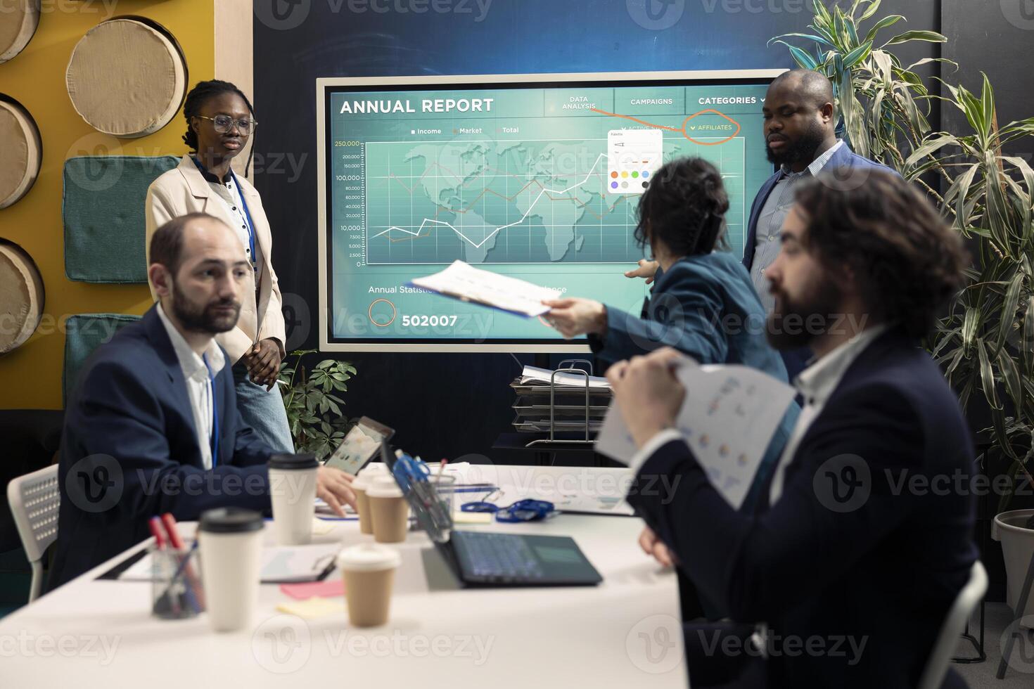 Staff members reviewing trends helping in making decisions to corelate with business goals. Forecast associates working together to meet project deadline, examine organizational data. photo