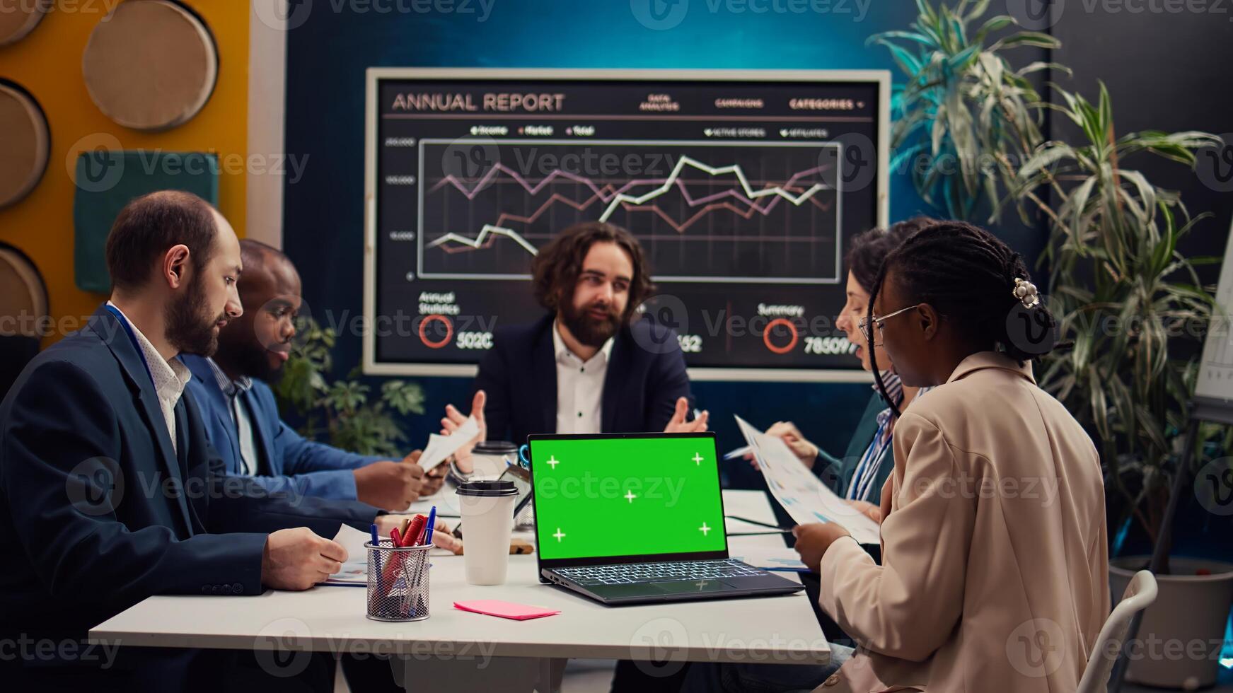 Product management team developing strategies with mockup display on laptop, sharing insight on projects and expressing concerns. Employees collaborating on enterprise growth. Camera B. photo