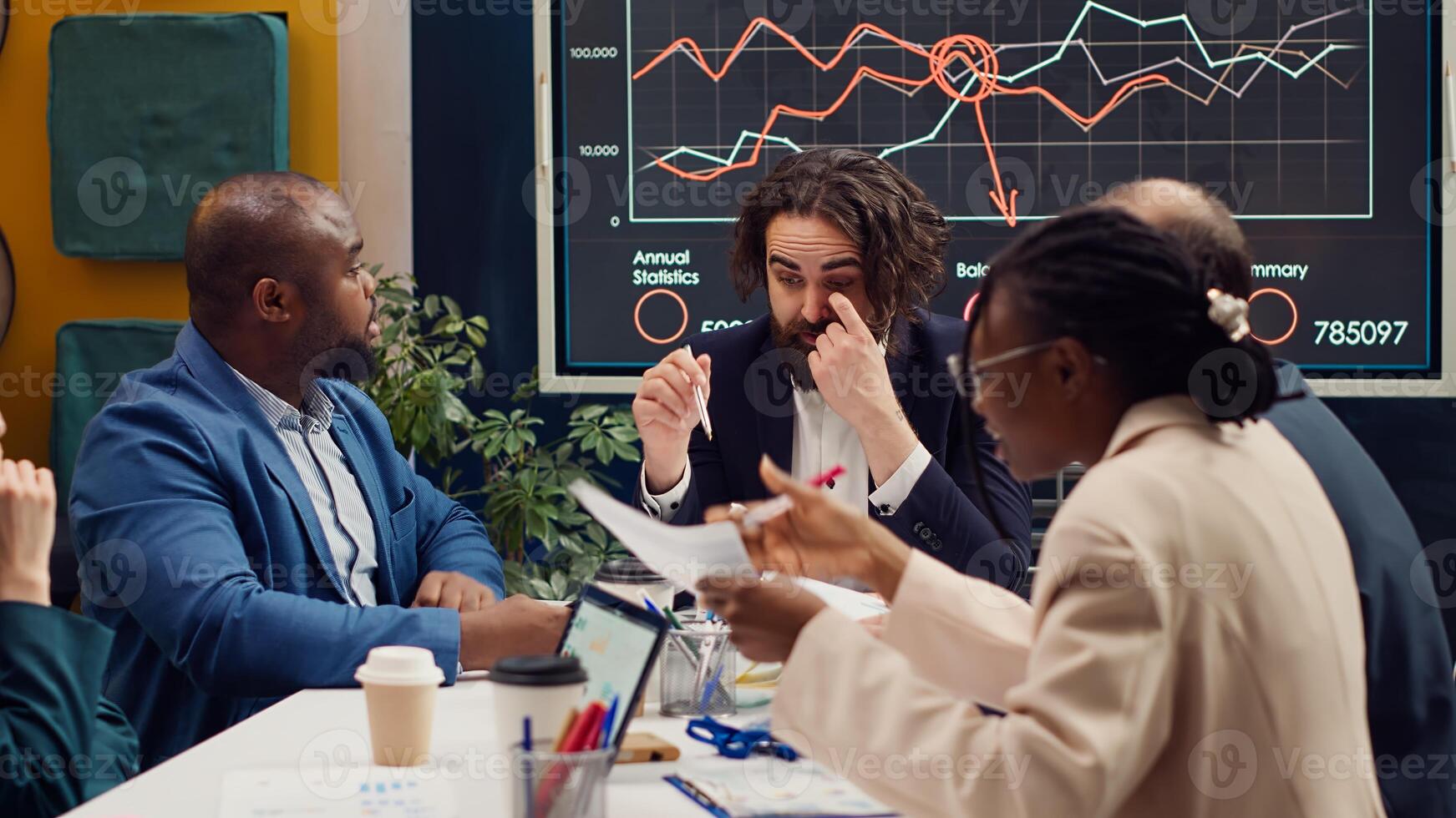 Coworkers addressing innovation initiatives in research and development efforts, making new plans and strategies to ensure goals accomplishment within the firm. Market supply and demands. Camera A. photo