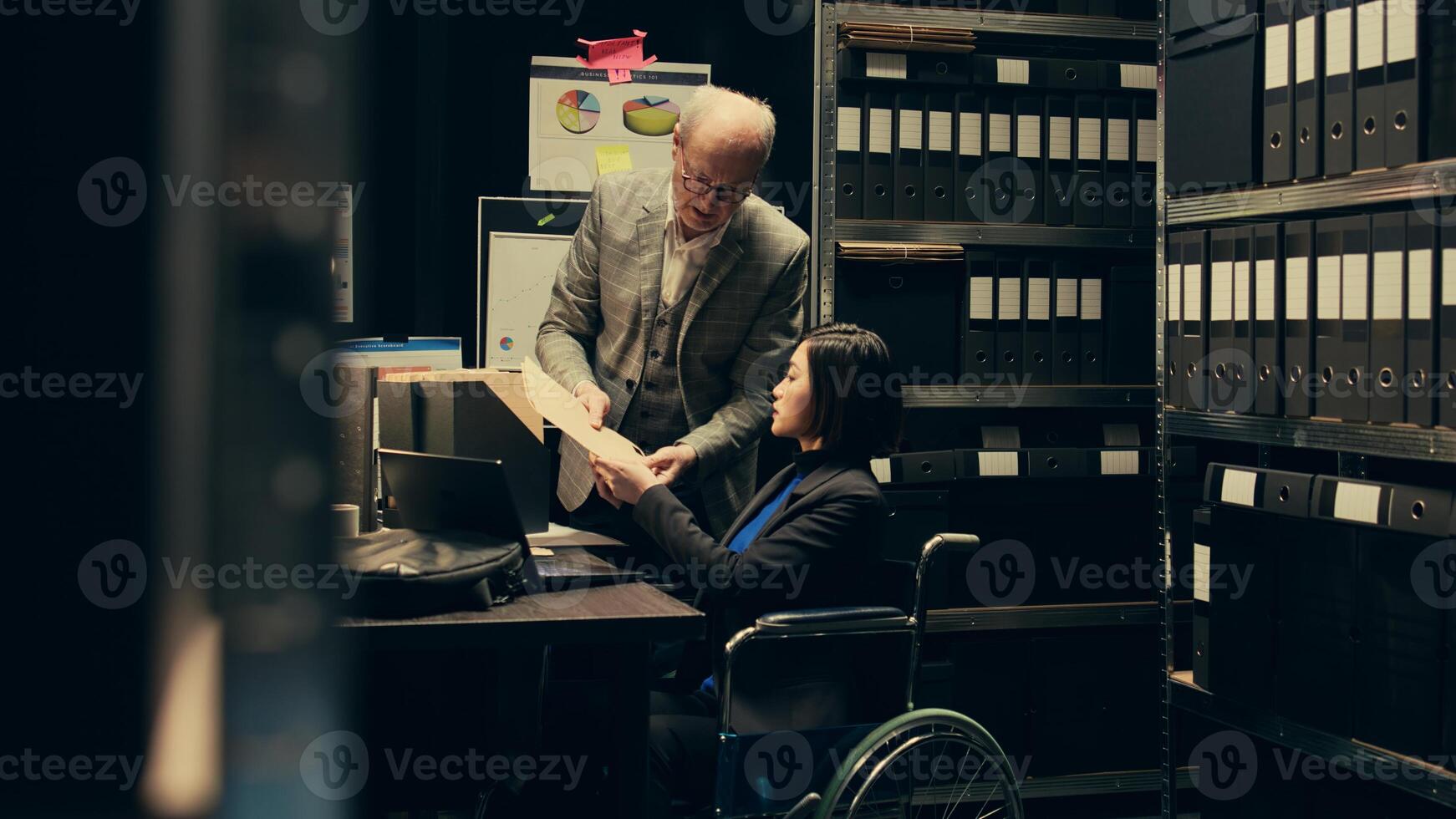 Forensic team extracting DNA samples for modern analysis in archive room, examining criminal evidence and compiles statistical data. Agent with disability working on private investigation. Camera B. photo