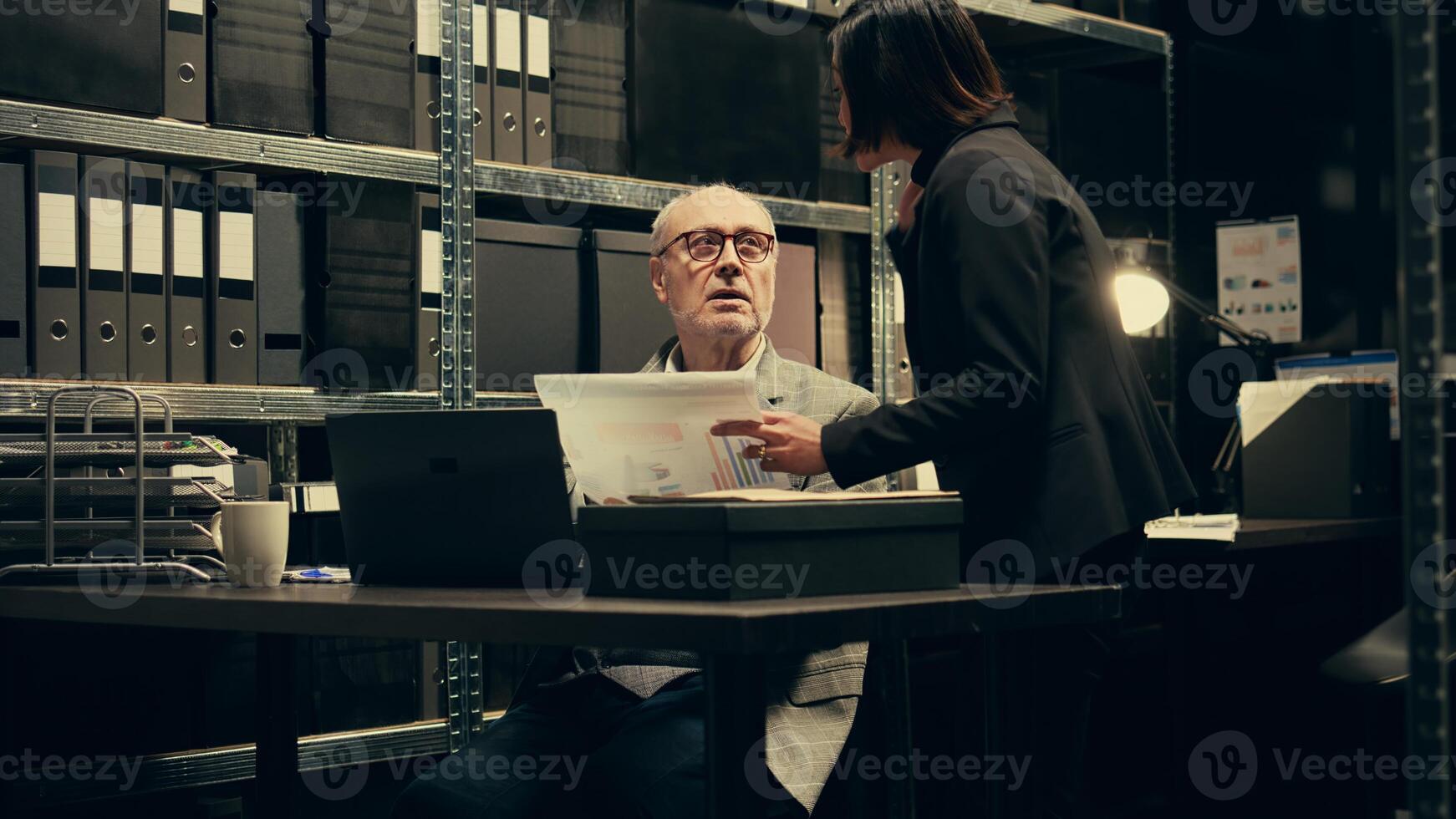 Federal investigators examining forensic evidence and autopsy reports to connect the dots and find a culprit. Team of detective and private agent working on solving criminal activity. Camera B. photo
