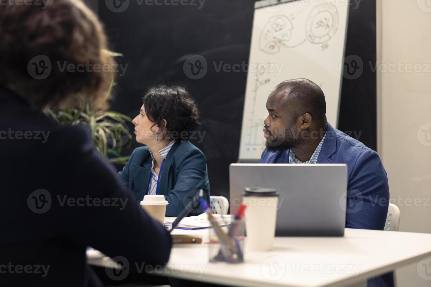 Staff members gathers for informal discussion to discover alternative financing sources and distribute current assets to guarantee fulfillment of targets. Gaining earnings prospects. photo