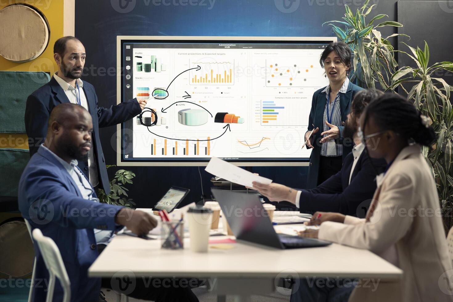 Team of partners working on resource allocation initiatives during a meeting, making important budgeting decisions to corelate with enterprise objectives. Coworkers review strategies. photo