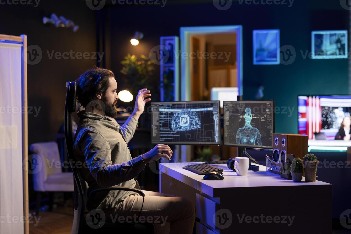 Computer scientist getting scared after AI becomes sentient, afraid of it spiraling out of control and dooming humanity. IT professional in home office worried by conscious artificial intelligence photo