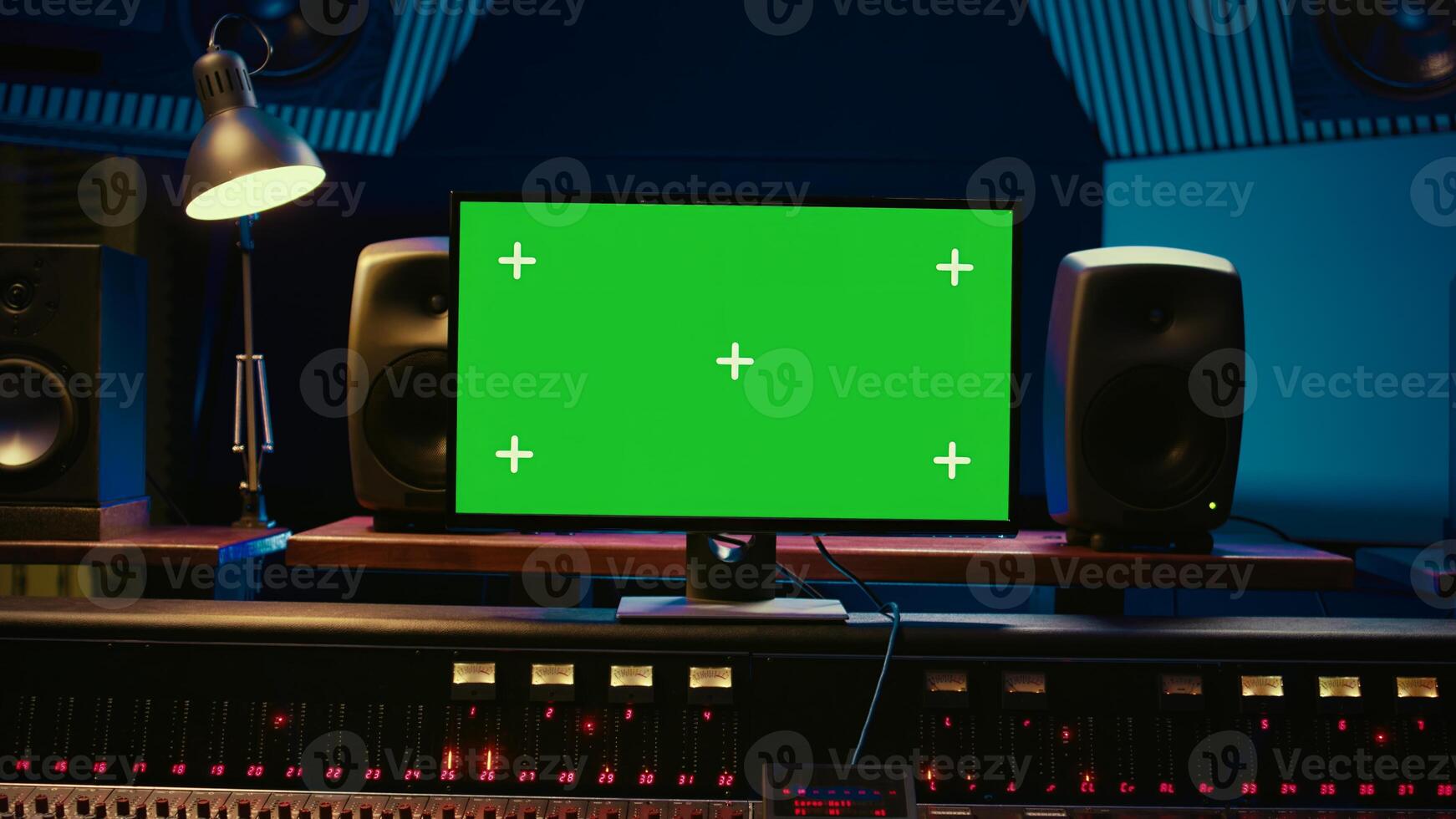 Empty professional recording studio control room with greenscreen on display, editing and processing tracks. Motorized faders, buttons and sliders operated for mix and master techniques. Camera B. photo