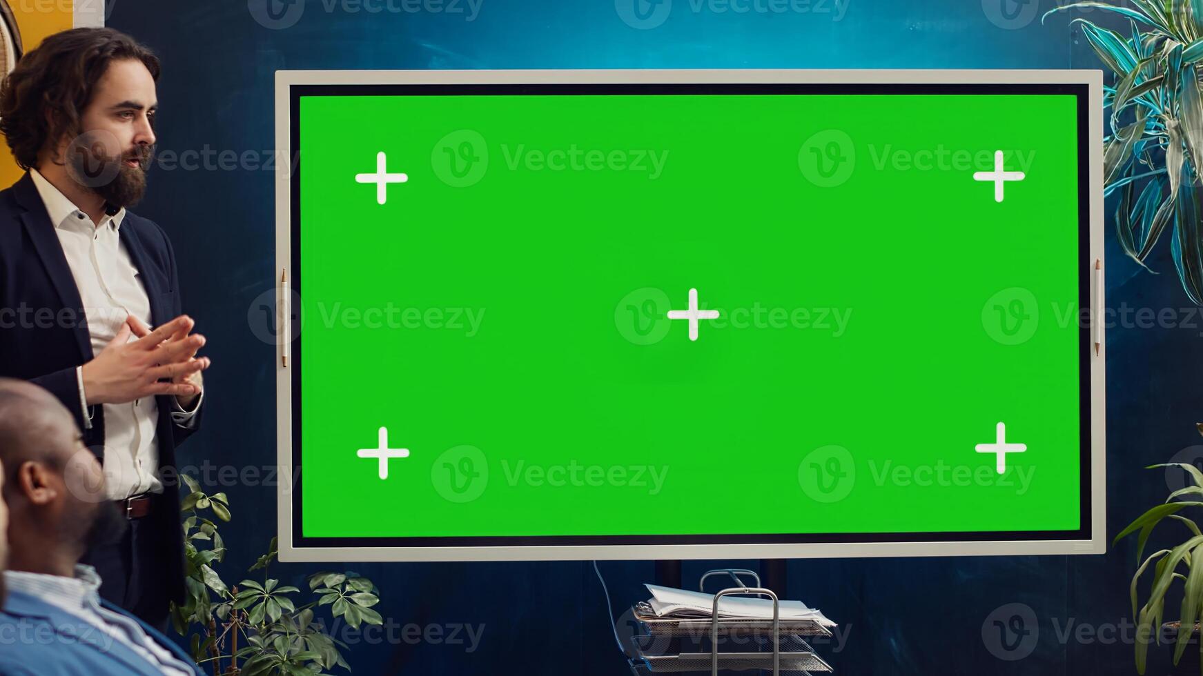Startup team using greenscreen interactive board in a strategy workshop meeting, working together to improve their skills and performance. Corporation employees prepare for collaboration. Camera A. photo