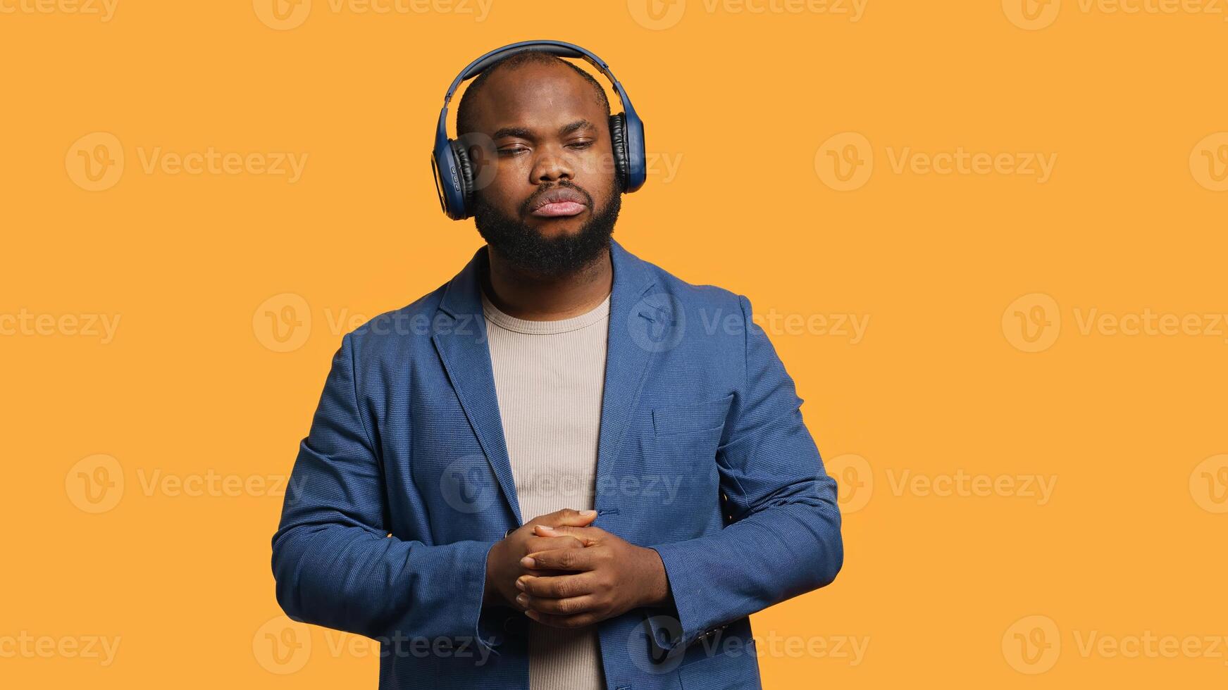African american man feeling exhausted from overworking and lack of sleep, suffering from headache and yawning, studio background. Tired BIPOC person feeling migraine from fatigue, camera A photo