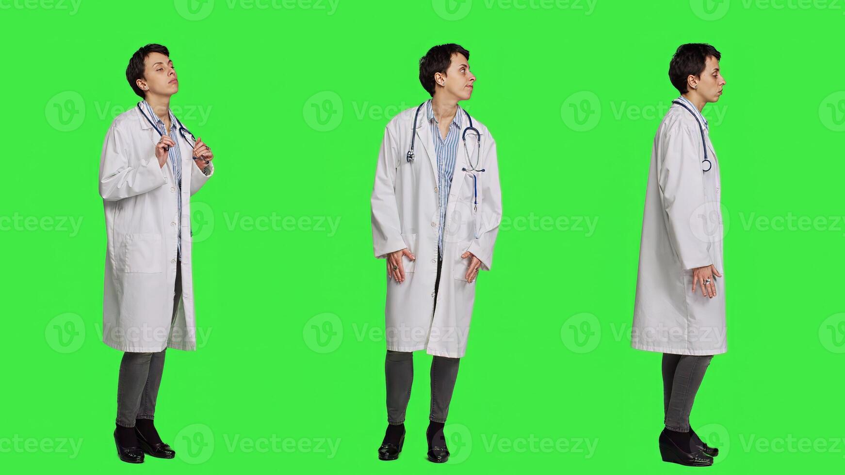 General practitioner waiting for patients to attend checkup appointments, feeling impatient against greenscreen backdrop. Woman physician with white coat waits for people, confident medic. Camera A. photo