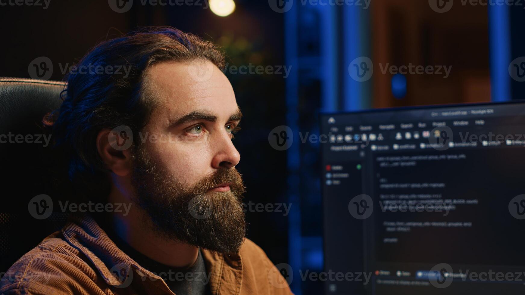Developer overthinking solutions while doing programming during remote job shift in office while drinking coffee. IT admin enjoying hot beverage working on PC early in the morning, camera A close up photo